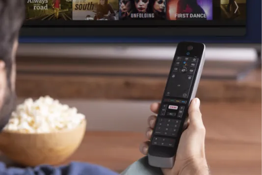 Man watching TV with a clear signal thanks